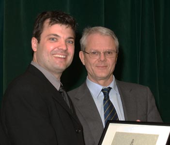 James Rutka (NeurSurg) (right) presents the Donald R. Wilson Award to Melfort Boulton (NeurSurg Resident)